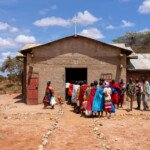 Maasai communtiy members line up for maize gifted by a local tourist lodge in southern Kenya. With their cattle dying and no crops, communities are suffering across southern Kenya